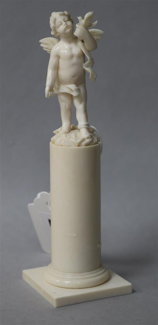 An ivory cherub on stand